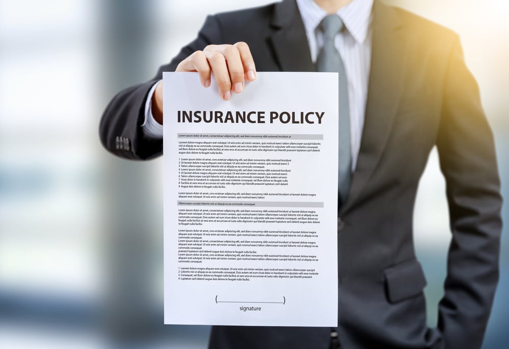 Man holding insurance policy